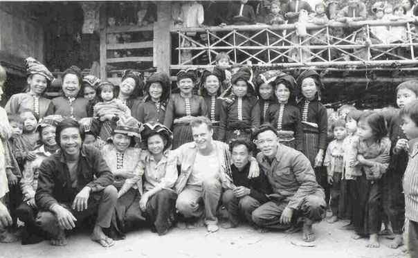 GROUP OF PEOPLE IN TRADITIONAL BUILDING