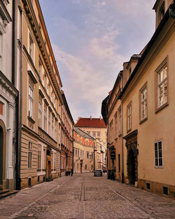 Street amidst buildings against sky