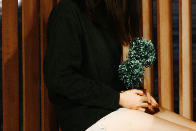 Low section of woman wearing shoes