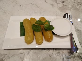 High angle view of vegetables in plate on table