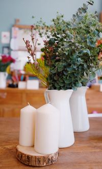 Close-up of white flower vase on table