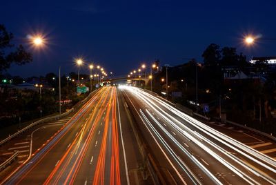 High angle view of light trails on road at night