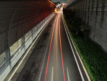 Light trails on road in city at night