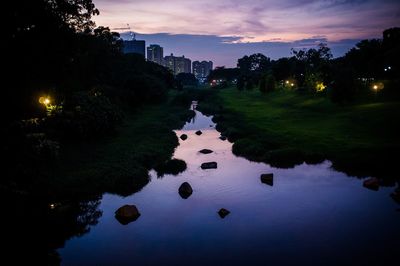 Scenic view of lake against sky at sunset