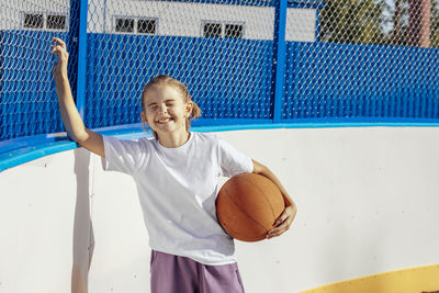 Golden hour glory, a girl's basketball passion shines bright in the sunset on the basketball court