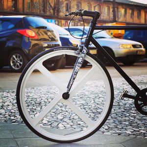 Close-up of bicycle parked on road