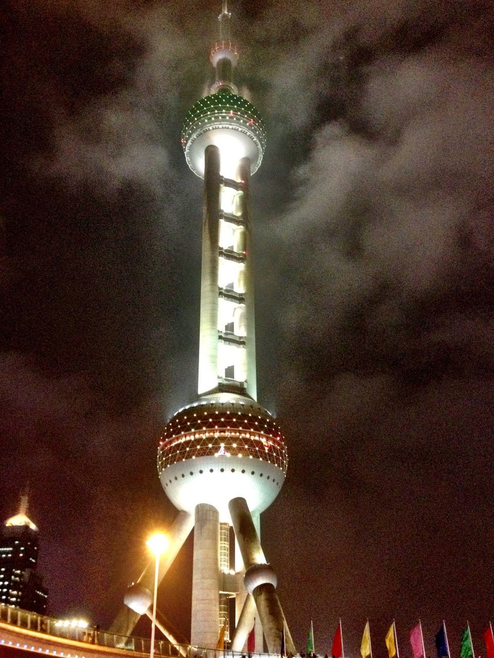 LOW ANGLE VIEW OF ILLUMINATED BUILDING AGAINST SKY