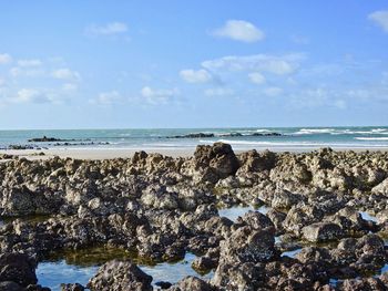 Scenic view of sea against blue sky