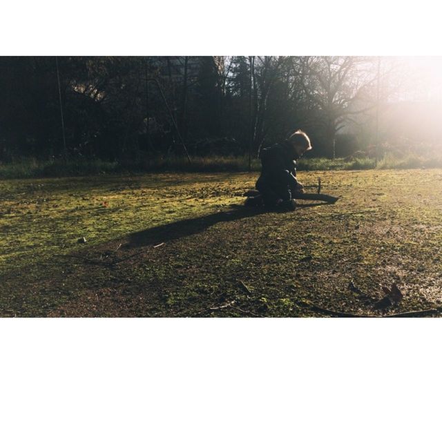 transfer print, lifestyles, auto post production filter, leisure activity, full length, field, grass, men, side view, sunlight, landscape, bicycle, rear view, standing, tree, grassy, transportation, walking