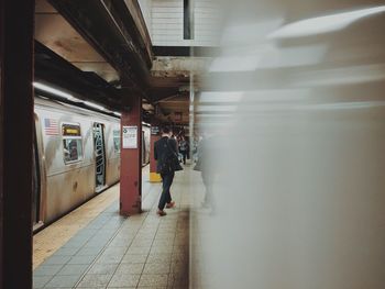 Rear view of woman walking in corridor