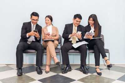 Group of people sitting at home