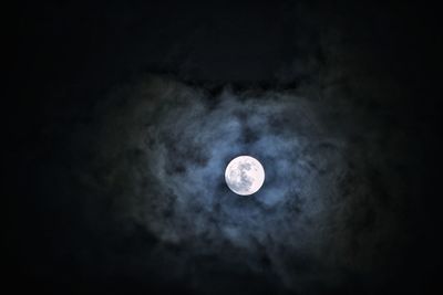 Low angle view of moon against sky at night