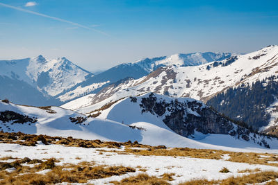 Scenic view of snowcapped mountains against sky