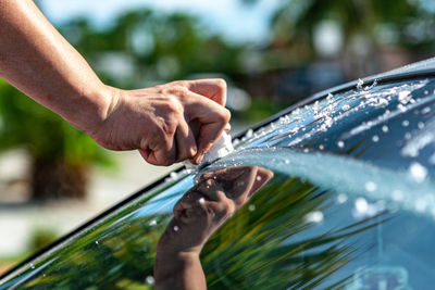 Close up image of hand writing on a car car window.