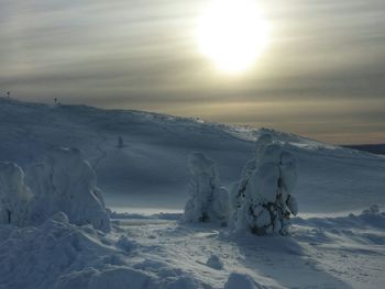 Scenic view of snow covered mountain against sky