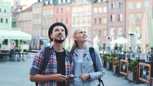 Young couple standing in city