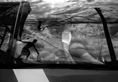 Low section of man against sky