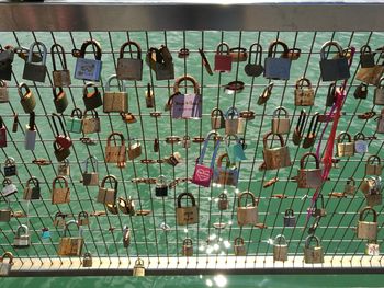 Close-up of padlocks hanging on metal structure