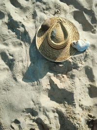 High angle view of sun hat on beach