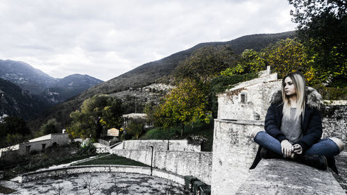 Young woman against mountains