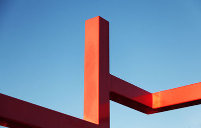 Low angle view of information sign against blue sky