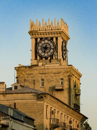 Low angle view of clock tower against sky