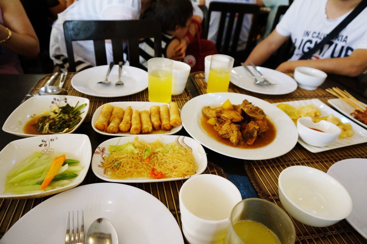 food and drink, food, indoors, freshness, plate, table, ready-to-eat, healthy eating, drink, bowl, high angle view, restaurant, still life, meal, fork, incidental people, serving size, spoon