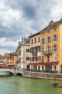 View of buildings against cloudy sky