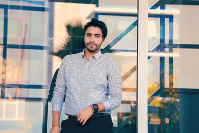 Portrait of young man standing outdoors