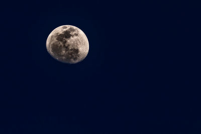 Low angle view of moon against sky at night