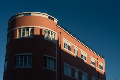 Low angle view of building against blue sky