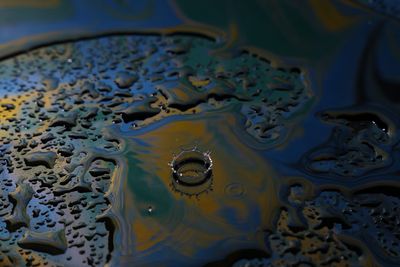 Full frame shot of water drop on table