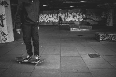 Low section of man skateboarding on skateboard