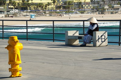 Man sitting on railing