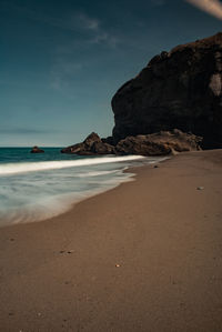 View of calm beach against sky
