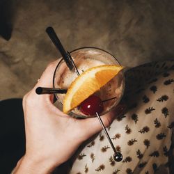 Close-up of hand holding cocktail 
