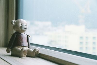 Close-up of toy on window sill
