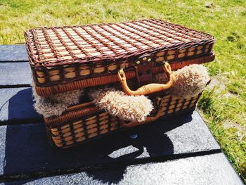 High angle view of wicker basket on field