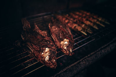 High angle view of meat on barbecue grill