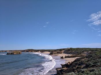 Scenic view of sea against blue sky