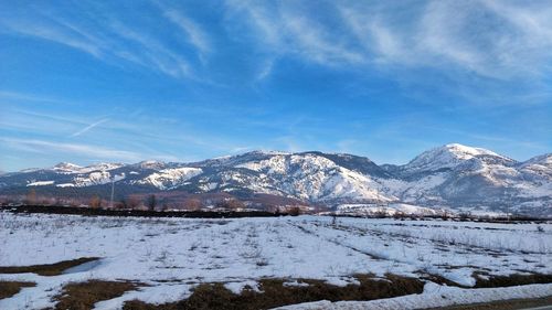 Scenic view of snowcapped mountains against sky