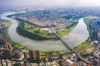 High angle view of river amidst buildings in city