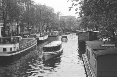 Boats moored at harbor