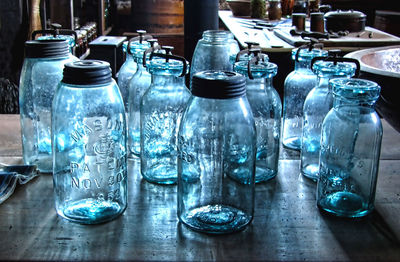 Close-up of glass bottles on table