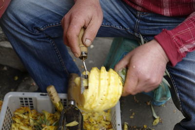 Midsection of man preparing food