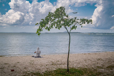 Scenic view of sea against cloudy sky