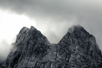 Low angle view of rock formation against sky