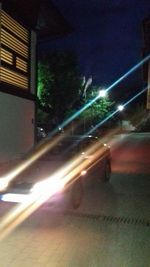 Blurred motion of illuminated street at night