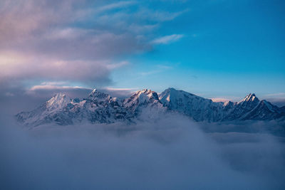 Scenic view of snowcapped mountains against sky