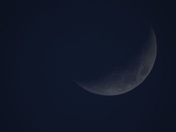 Low angle view of moon against sky at night